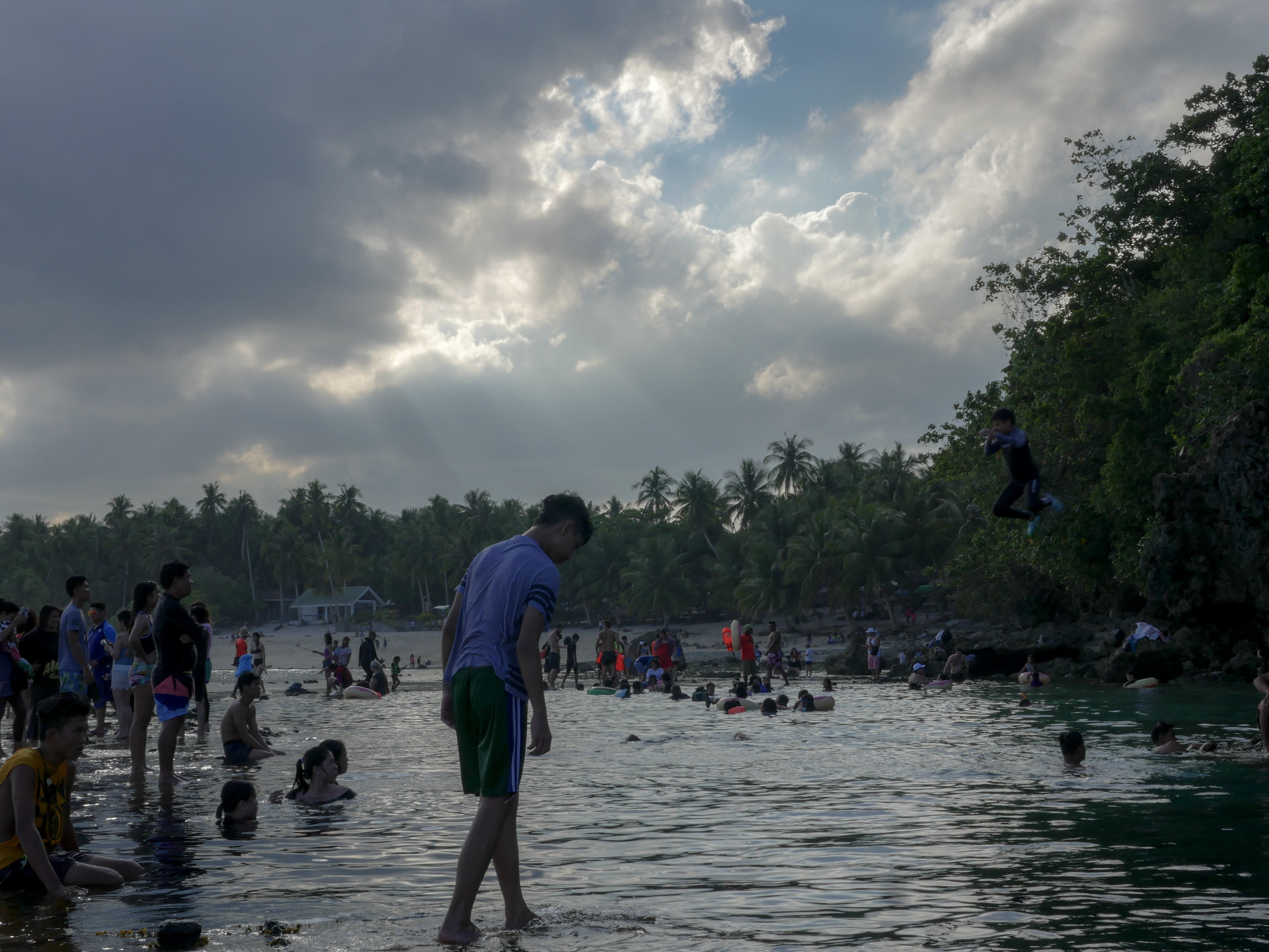 people enjoying at magpupungko tidal rock pools in siargao philippines